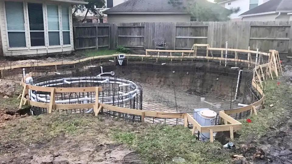 Rough plumbing stubbed through the steel of a Wet Pools shell
