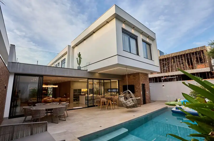 Modern home with a geometric pool and covered outdoor lounge