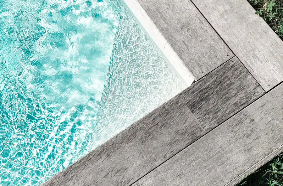 Close detail of pool coping meeting the decking