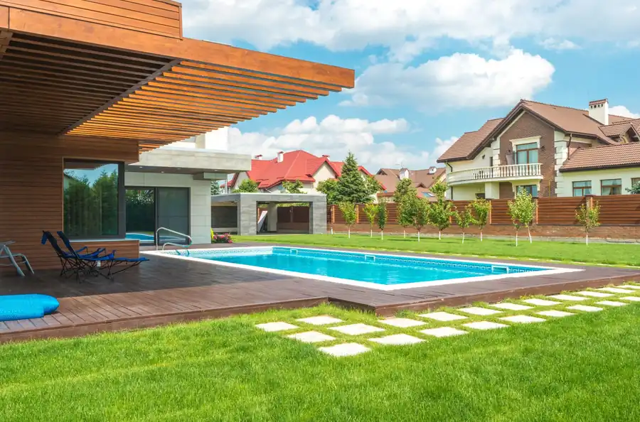 Straight-line pool with stepping-stone decking and lawn