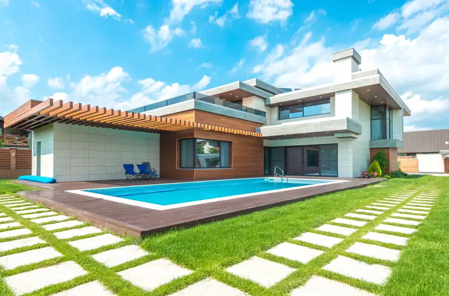 Contemporary house with a straight-line pool and clipped lawn